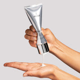the MAX facial cleanser dispensing onto palm